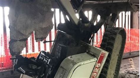 Worker injured when excavator crashes through 2 floors in 